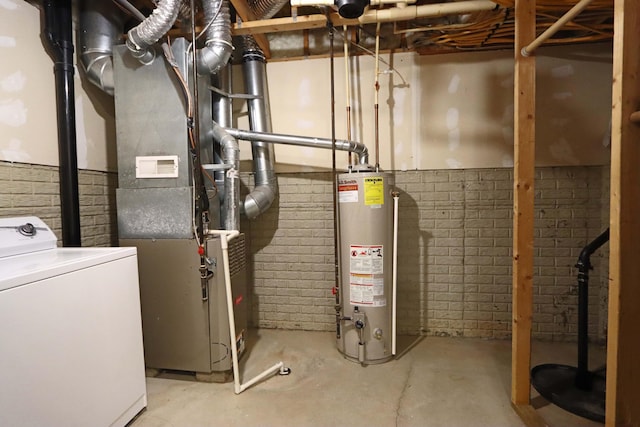 utility room featuring heating unit, water heater, and washer / clothes dryer