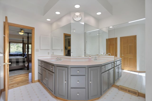 bathroom featuring ceiling fan and vanity