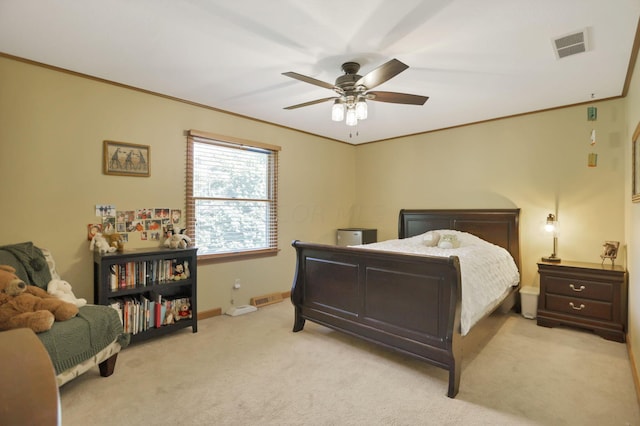 bedroom with ceiling fan, light carpet, and ornamental molding