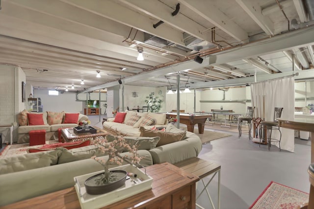 living room featuring concrete flooring and billiards