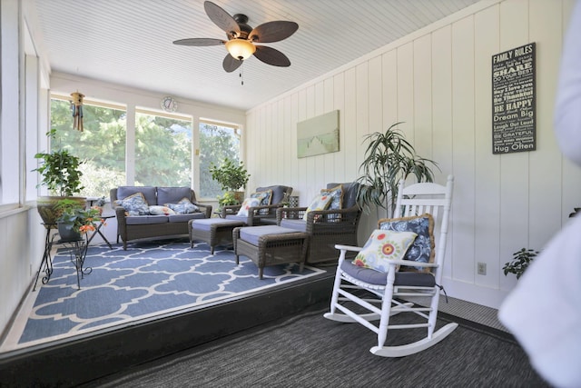 sunroom featuring ceiling fan