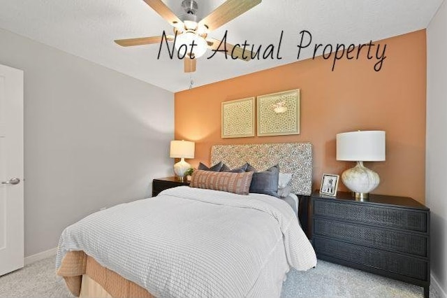 bedroom with light carpet and ceiling fan