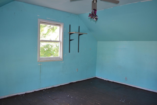 additional living space featuring ceiling fan, dark hardwood / wood-style floors, and vaulted ceiling