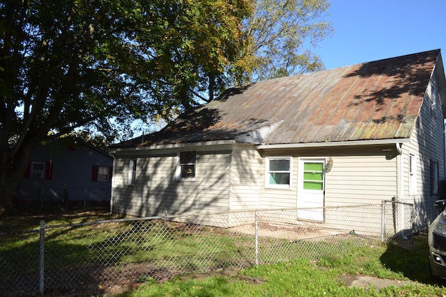 back of house with a yard