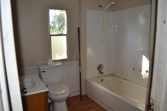 full bathroom with hardwood / wood-style flooring, vanity, toilet, and bathing tub / shower combination