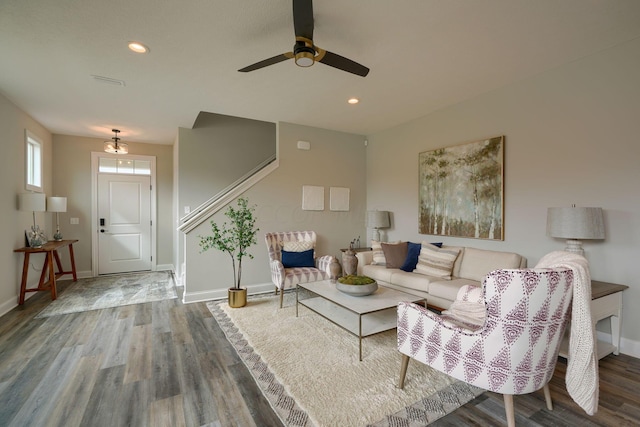 living room with ceiling fan and wood-type flooring