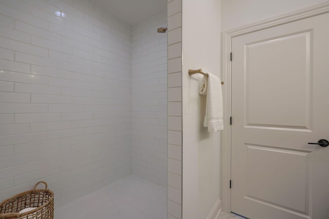 bathroom with a tile shower