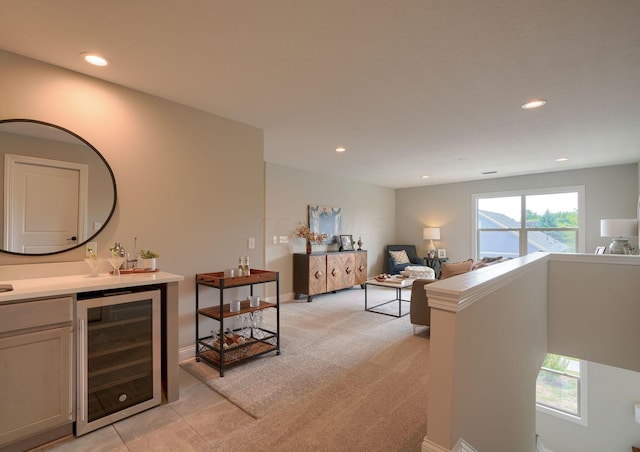 carpeted living room with bar and wine cooler