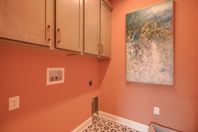 washroom with cabinets, hookup for a washing machine, and hookup for an electric dryer