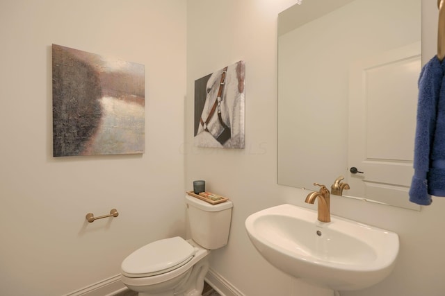 bathroom with toilet and sink