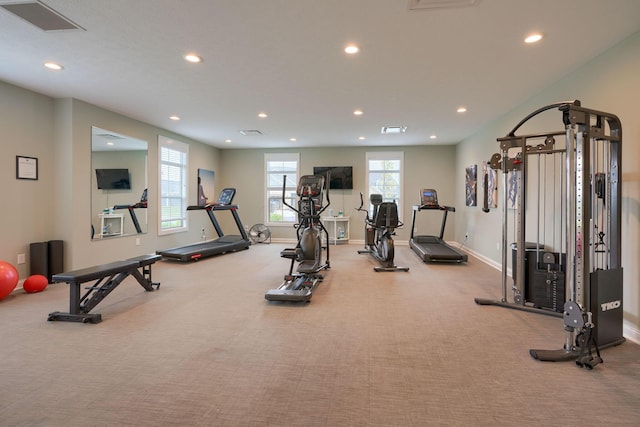 exercise room featuring light colored carpet