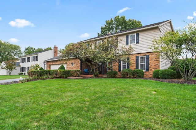 view of front of property with a front lawn and a garage