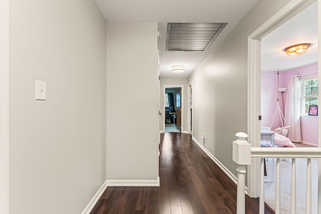 hall with dark hardwood / wood-style flooring