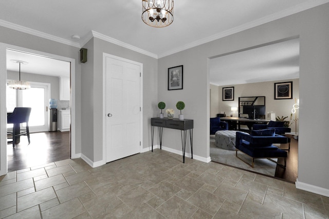 entryway featuring an inviting chandelier and crown molding