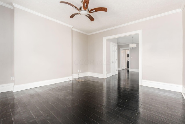 spare room with dark hardwood / wood-style floors, crown molding, and ceiling fan with notable chandelier