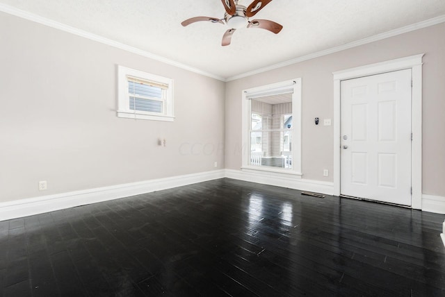 interior space featuring ceiling fan, dark wood-type flooring, a textured ceiling, and ornamental molding