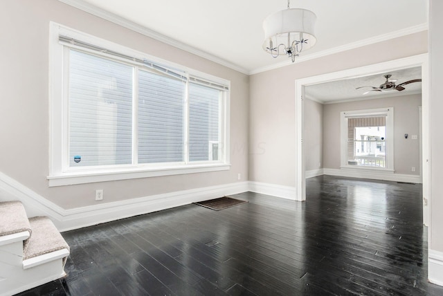 dining area with dark wood-type flooring, ceiling fan with notable chandelier, and ornamental molding