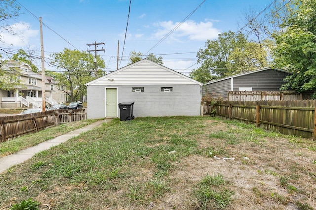 rear view of house with a lawn