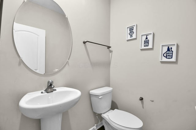 bathroom with sink and toilet