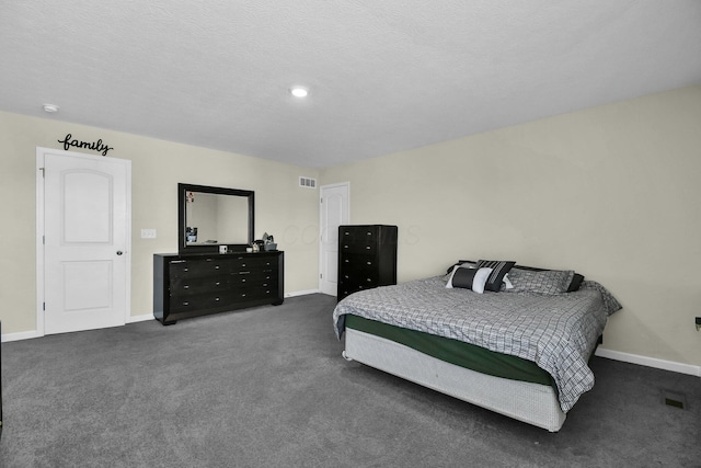 carpeted bedroom with a textured ceiling