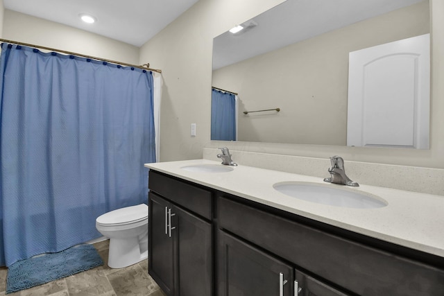 full bathroom with shower / tub combo, vanity, and toilet