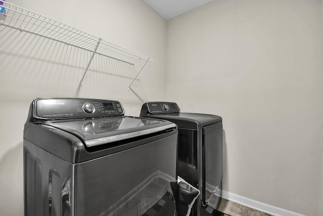 washroom featuring washer and dryer and hardwood / wood-style flooring