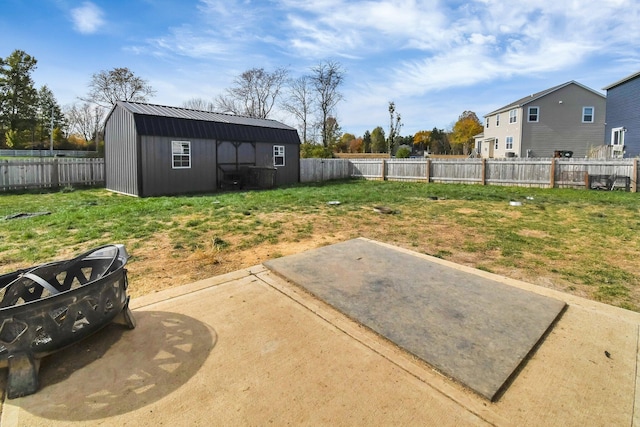 view of yard featuring a patio and a shed