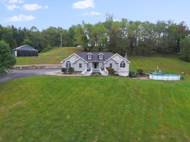 view of front of property featuring a porch and a front lawn