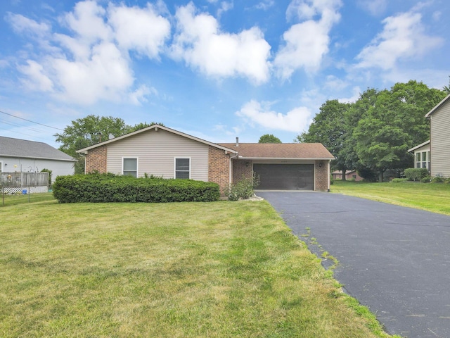 view of front facade featuring a garage and a front lawn