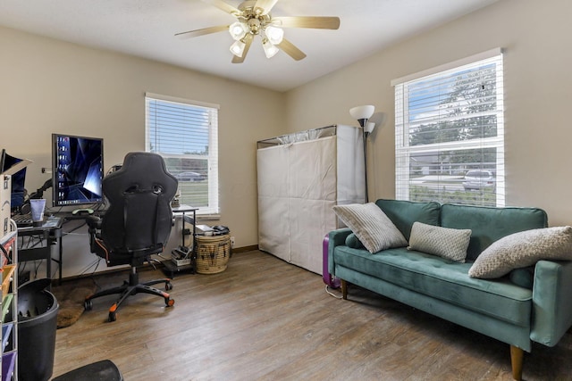 office area featuring wood-type flooring and ceiling fan