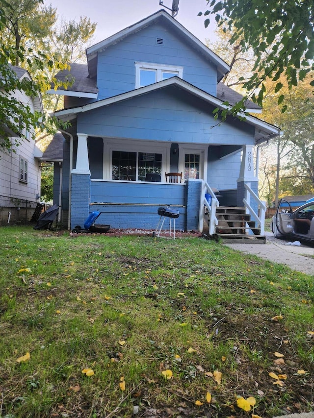 view of front of house featuring a front lawn and a porch