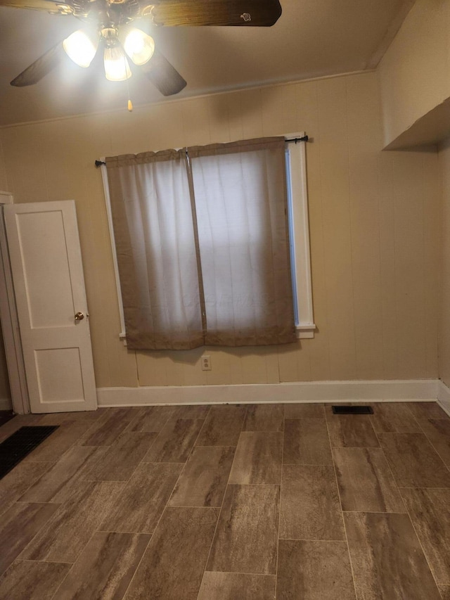 spare room with ceiling fan