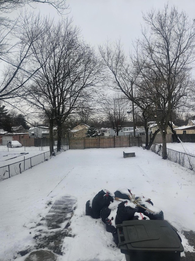 view of yard layered in snow