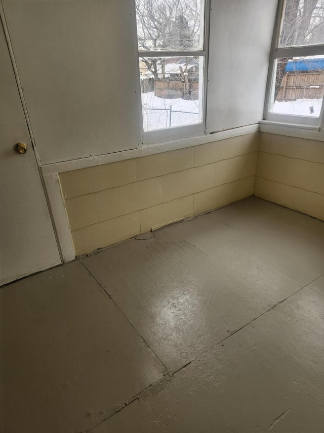 spare room with concrete flooring