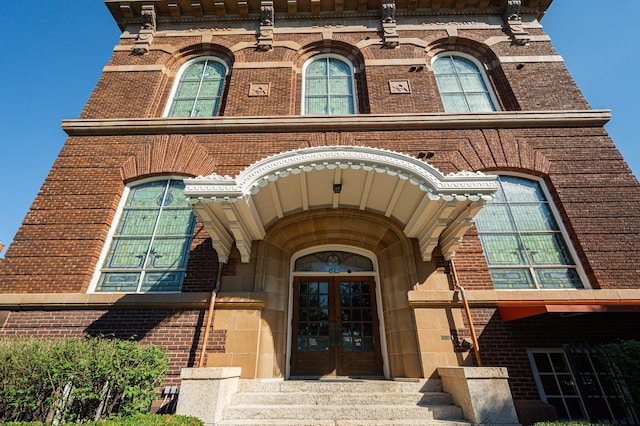 view of exterior entry featuring french doors