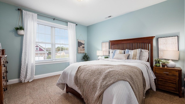 bedroom with light colored carpet