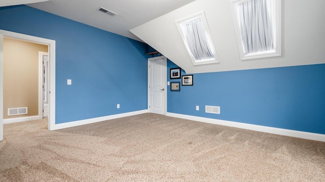 bonus room featuring carpet and lofted ceiling