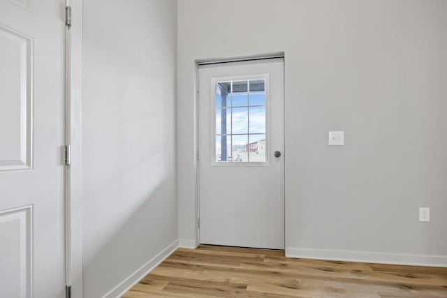 doorway to outside featuring light wood-type flooring