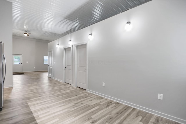 unfurnished room featuring ceiling fan and light hardwood / wood-style flooring