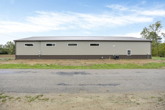 view of side of home featuring central air condition unit