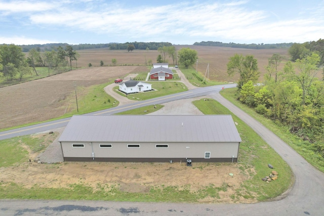 birds eye view of property featuring a rural view