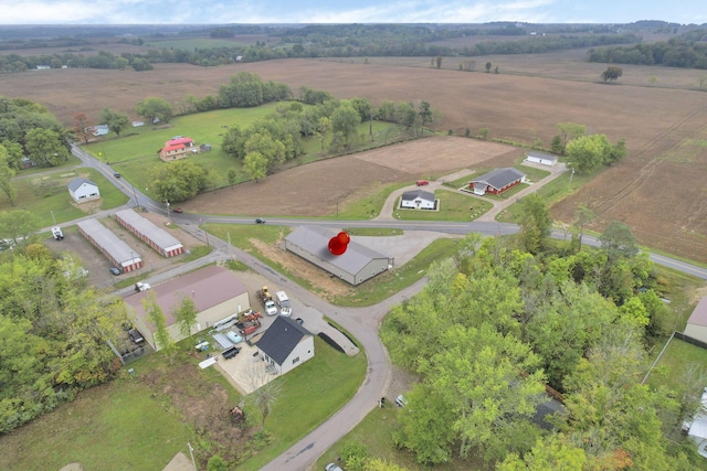 birds eye view of property with a rural view