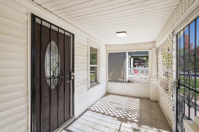 unfurnished sunroom featuring plenty of natural light