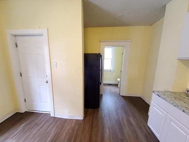 hallway featuring dark wood-type flooring