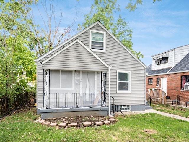 rear view of house with a lawn