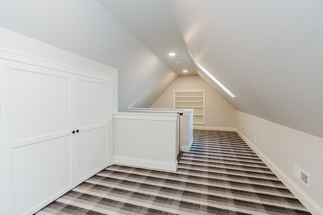 additional living space with light carpet and lofted ceiling