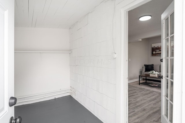 spacious closet featuring hardwood / wood-style floors