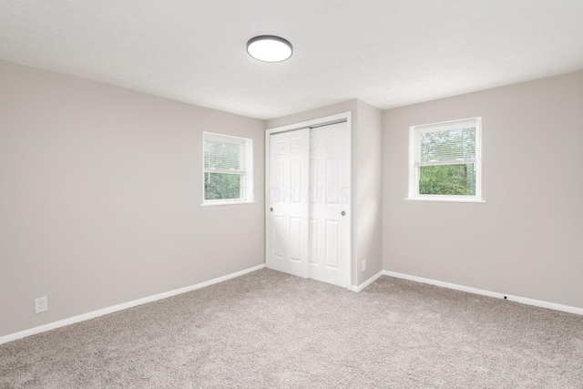 2789 Berrell Ave, Columbus, OH 43211 - unfurnished bedroom featuring carpet flooring and a closet