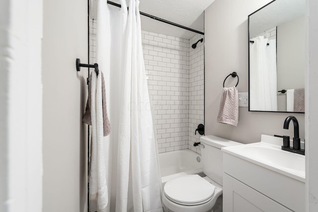 full bathroom featuring vanity, toilet, shower / bathtub combination with curtain, and a textured ceiling