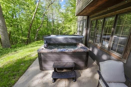 view of patio with a hot tub